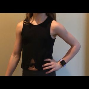 Black tank top with knot.